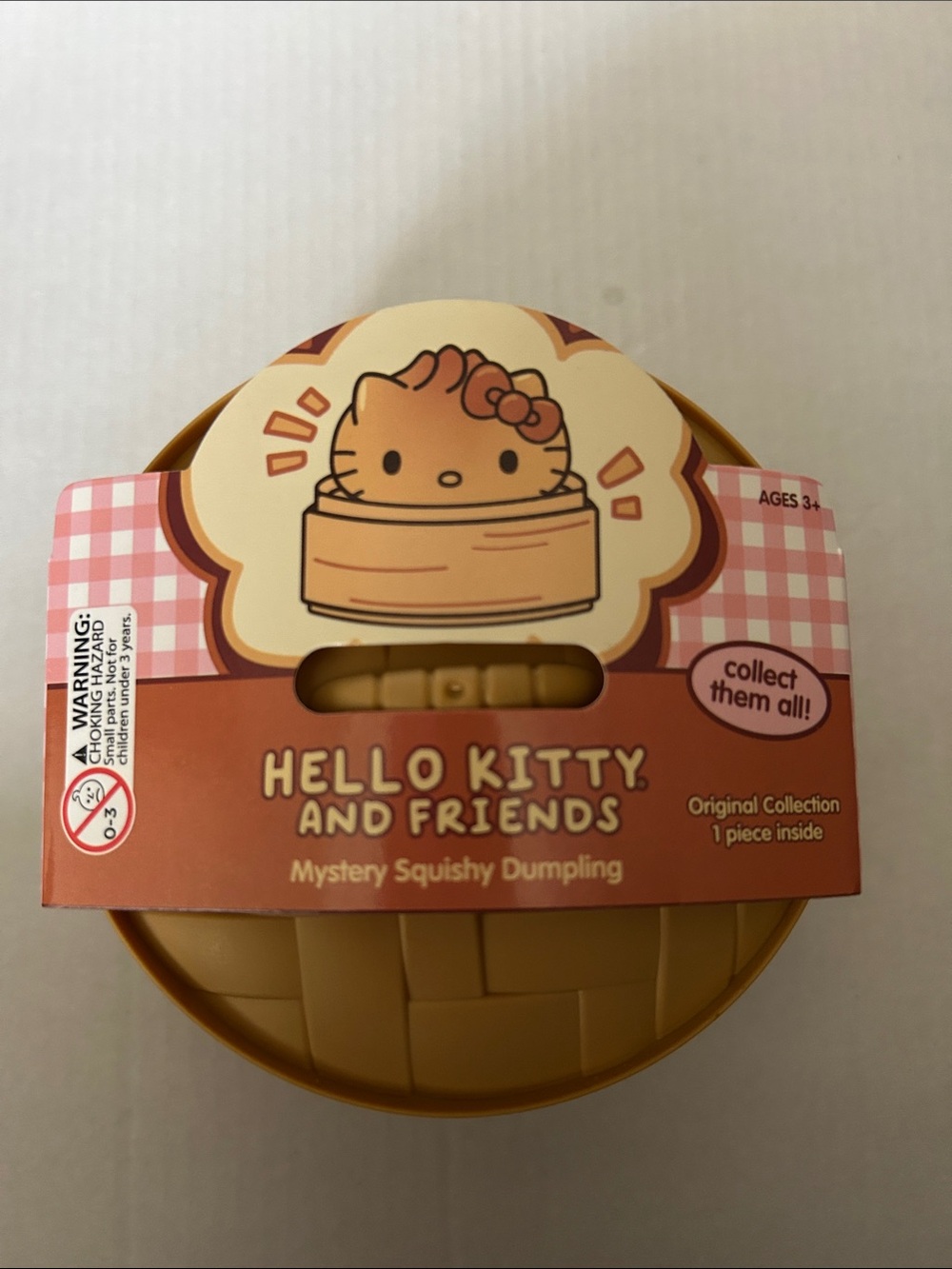 Hello Kitty Mystery Squishy Dumpling - Pink and Brown Packaging